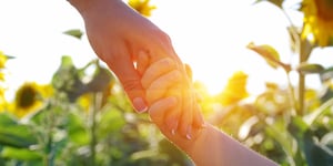 sunflowers_holding-hands_AdobeStock_377856522_copyright-Alekss_2000x1000px